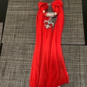 New with tags red scarf with metal arrangement